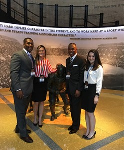  STHM students Avery Ellis (left), Brooke Williams (second from left), and Kristen Kemnitzer (right) meet with Bowie State University athletic director Clyde Doughty at the NCAA’s Hall of Champions.