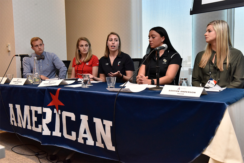 Samantha Wolkoff, center, a student-athlete from the University of Cincinnati, provides her thoughts during a panel discussion.