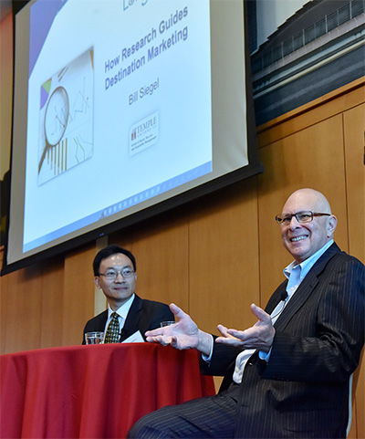 CEO and founder of Longwoods International Dr. Bill Siegel, right, responds to STHM Professor Dr. Xiang (Robert) Li during the question-and-answer phase or Siegel’s visit as STHM Executive in Residence.