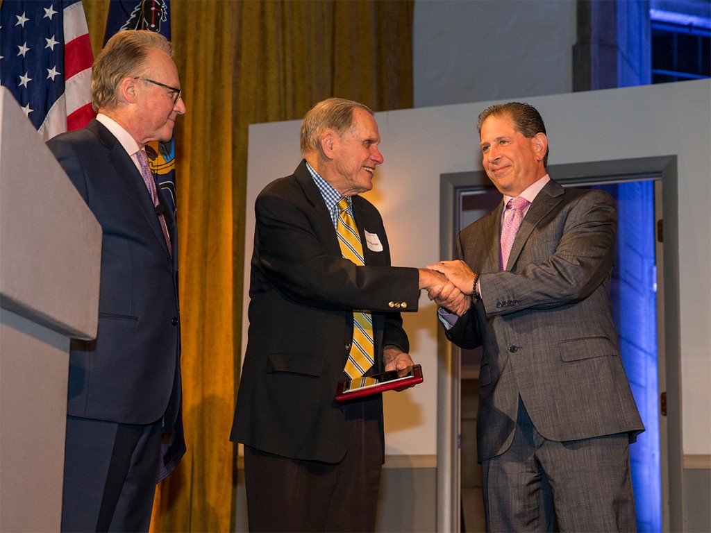 Brett Kratchman, right, receives an alumni leadership from STHM Dean Dr. M. Moshe Porat, left, and Warren V. “Pete” Musser during the Musser Awards for Excellence in Leadership dinner in November 2017. (Photo courtesy Temple University Photography/Joseph Labolito)
