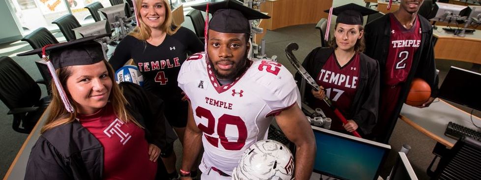 male football player and women athletes standing together